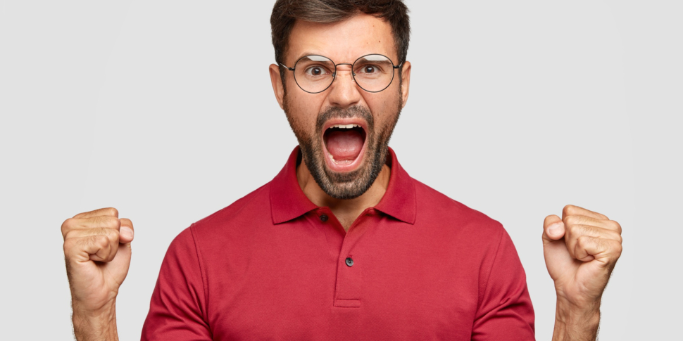 pissed-angry-unshaven-man-keeps-hands-fists